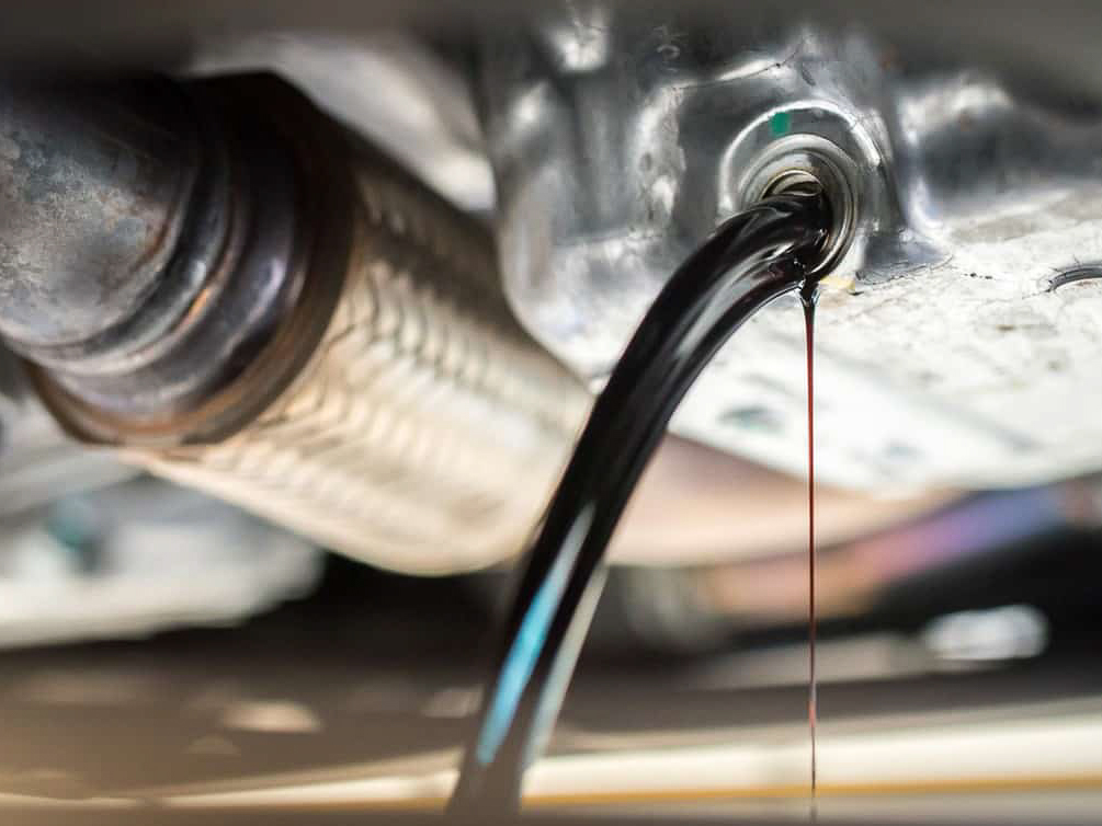 Drain-the-old-oil-from-the-engine-through-the-drain-plug.-Changing-the-oil-in-a-car-engine